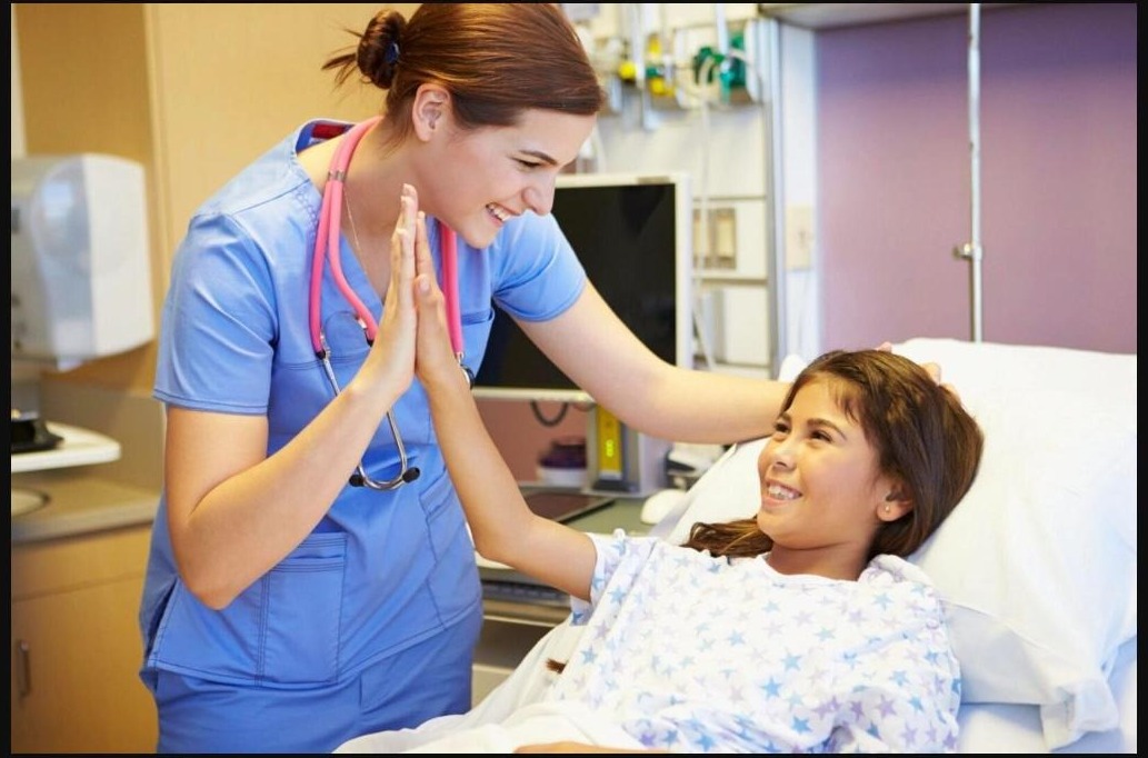 Nurse comforting a young patient